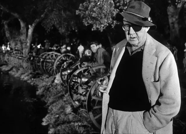 Director John Ford holding cigar and wearing the eye patch he needed late in life, on set of Civil War scene, the Battle of Shiloh, fr. his film "How the West Was Won."