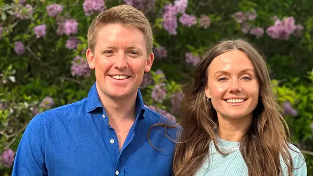Archive portrait of Hugh Grosvenor and Olivia Henson in front of flowering plants.
