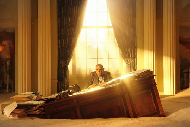 Laurence Fishburne at a desk in a scene from Megalopolis
