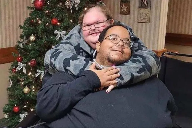 Archive photograph of Tammy Slaton with Caleb Willingham beside a Christmas tree.