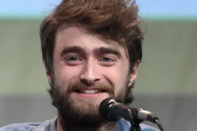 Radcliffe speaking at a press event