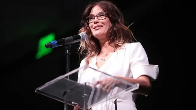 Teri Hatcher speaking at a microphone