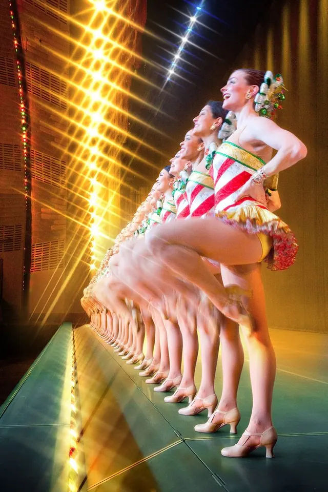 Rockettes dancers performing in a line.