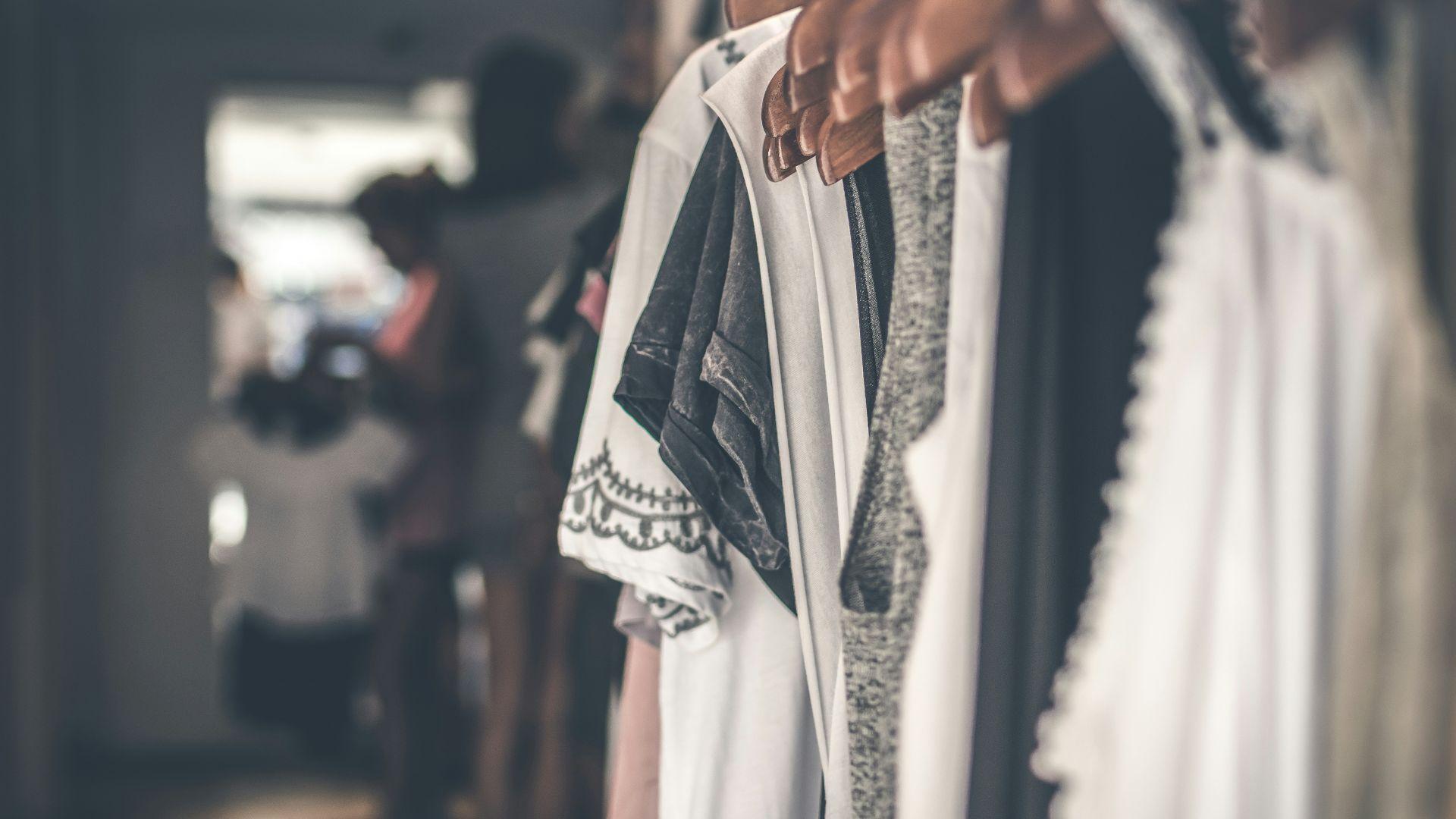 A person browsing clothes; illustrative photograph.