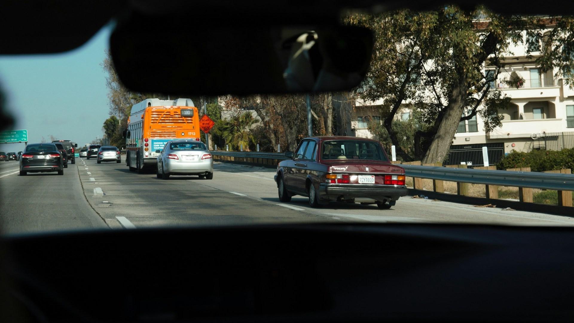 Cars moving along a city street