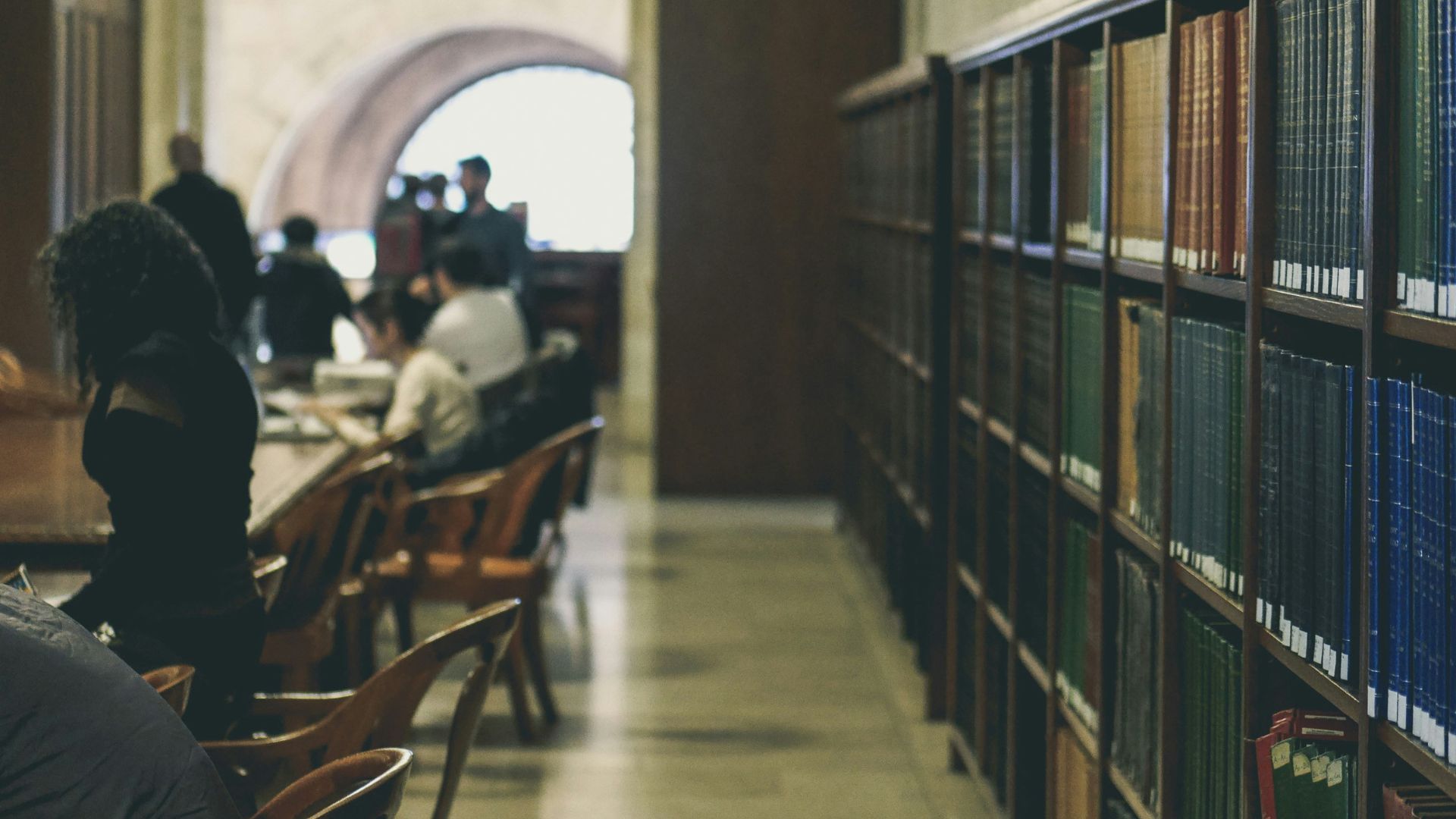 People in a library; illustrative archive photograph.