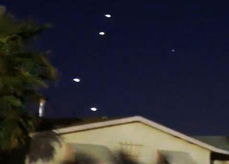 Archive image of lights above houses; not authenticated as this sighting.