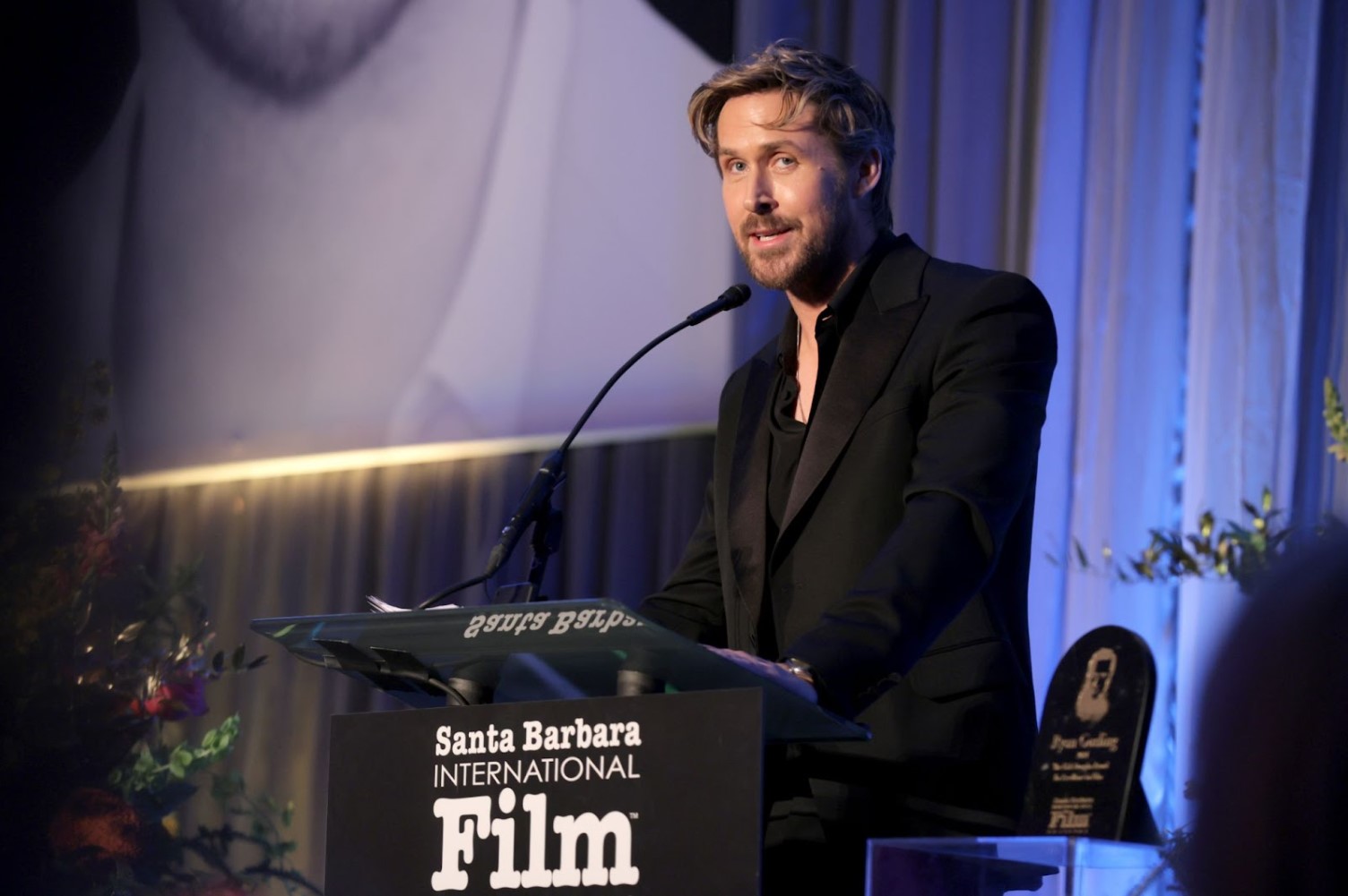 Ryan Gosling speaking at a film-festival podium