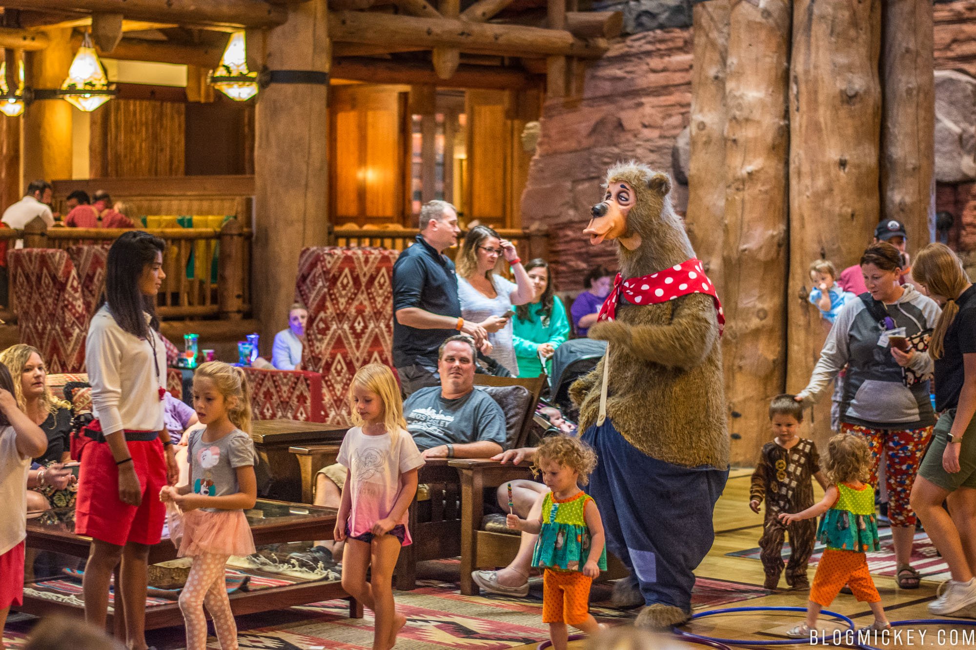 Costumed bears meeting visitors outside the attraction.