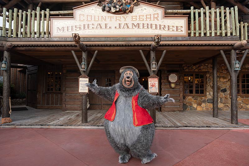 A costumed bear outside the Country Bear attraction.