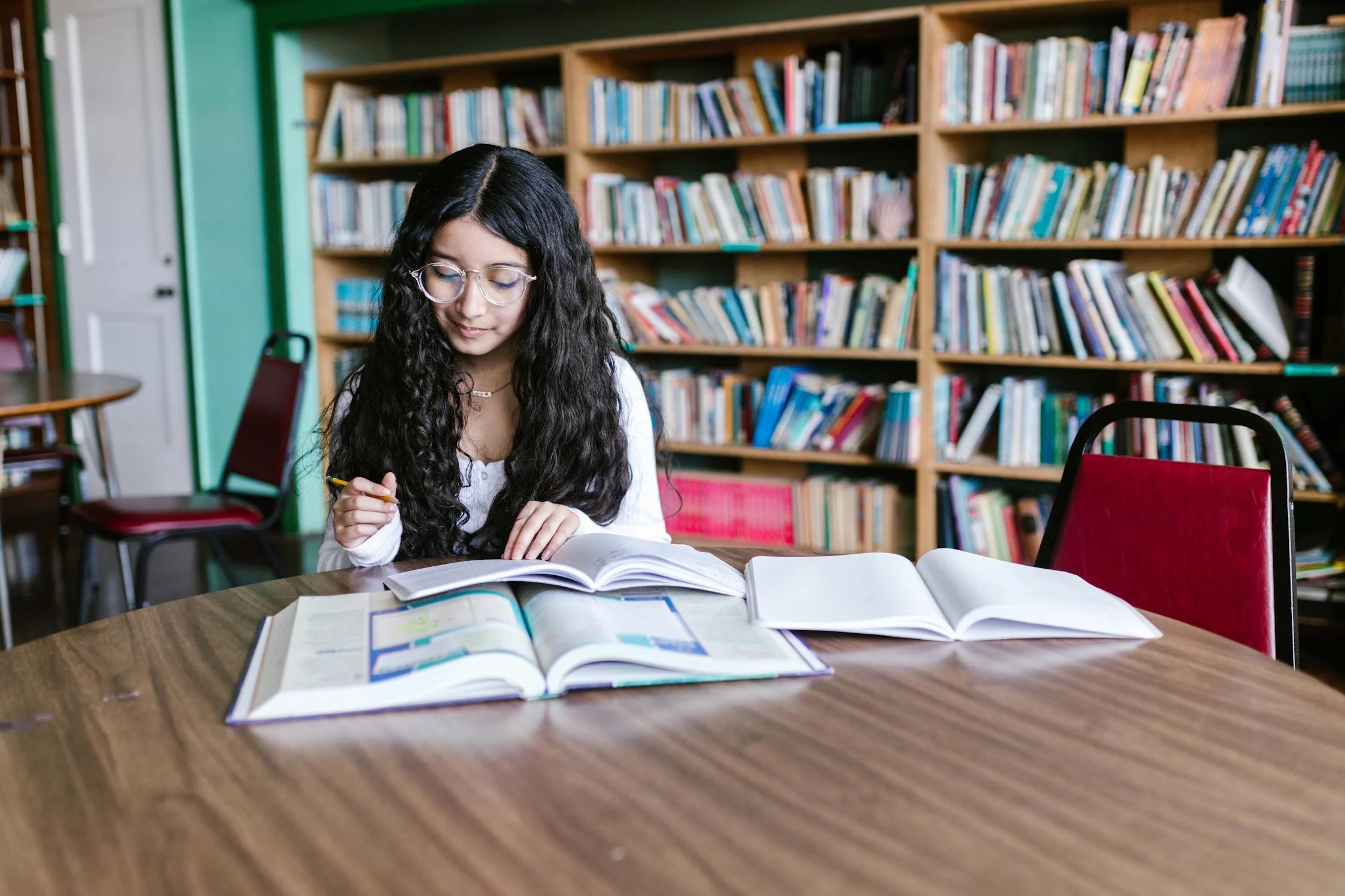A reader in a library; illustrative photograph.
