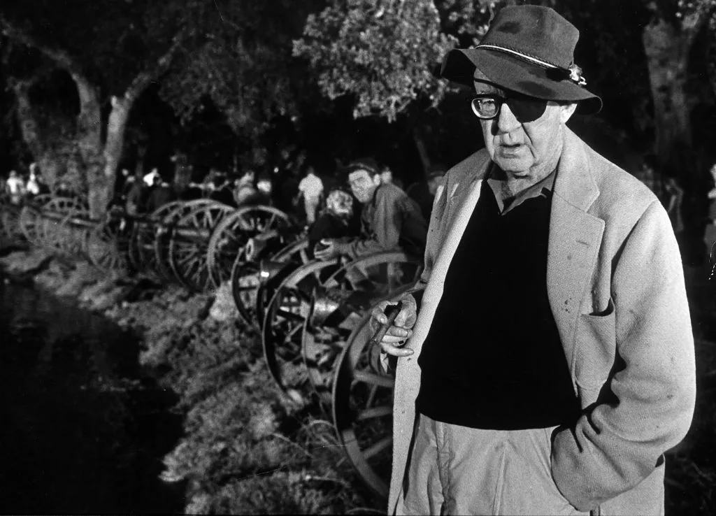 Director John Ford holding cigar and wearing the eye patch he needed late in life, on set of Civil War scene, the Battle of Shiloh, fr. his film "How the West Was Won."