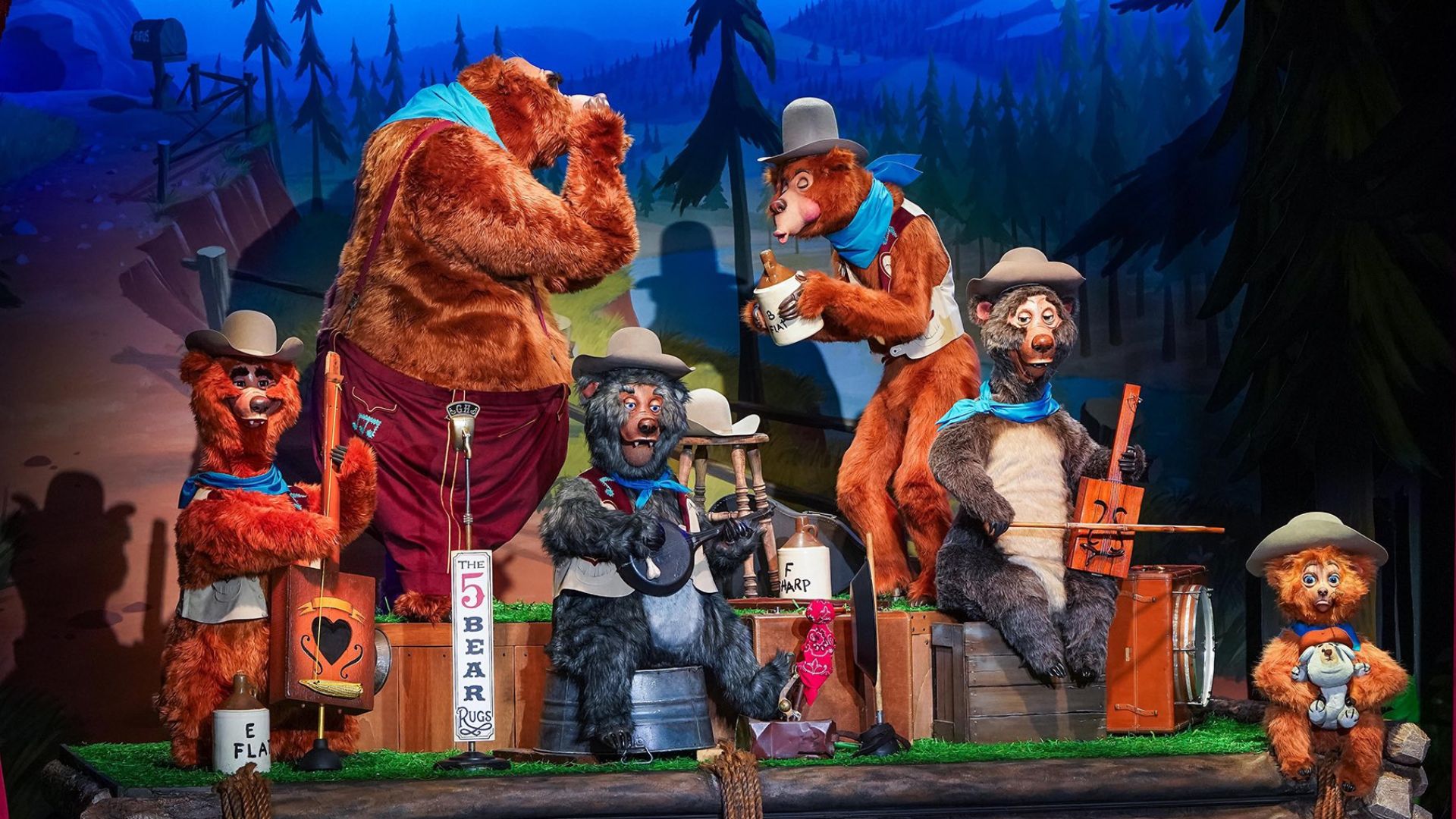 Animatronic bears performing on a stage.
