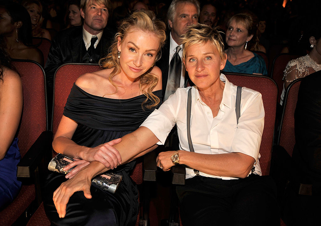 Portia de Rossi and Ellen DeGeneres seated together at an event