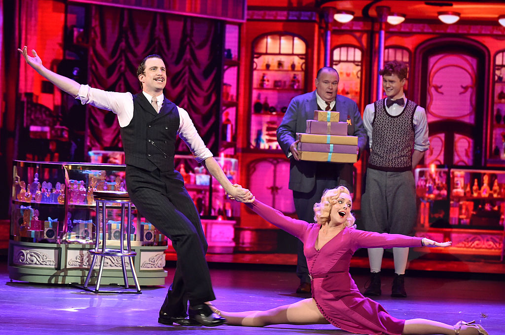 Gavin Creel and fellow performers in a colorful Broadway production